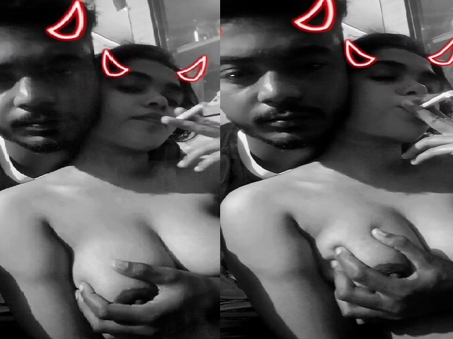 Girlfriend smoking cigarette with boob press